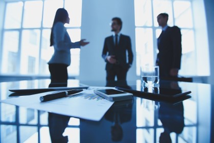 Telecom executives discussing.jpg